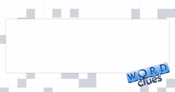 Showily decorated Crossword Clue